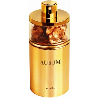 Aurum от Ajmal. Сладкий золотой аромат огромная охапка белых цветов на подложке из мускуса пудры ванили и древесины.
