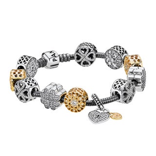 Серебряный браслет 3900 руб. сменные шармы из серебра и золота с кубическими цирконами от 4550 руб. каждый все Pandora.