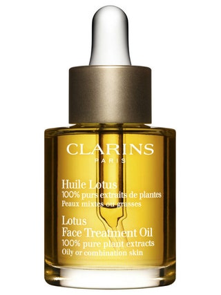 Косметическое масло для комбинированной и жирной кожи Huile Lotus Clarins.