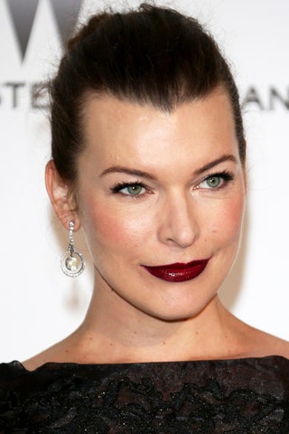 Милла Йовович на вечере amfAR 22 мая 2014 года.