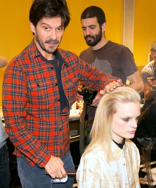 Гвидо Палау. Гвидо причесывает модель ХаннеГаби Одиеле перед показом Versace.