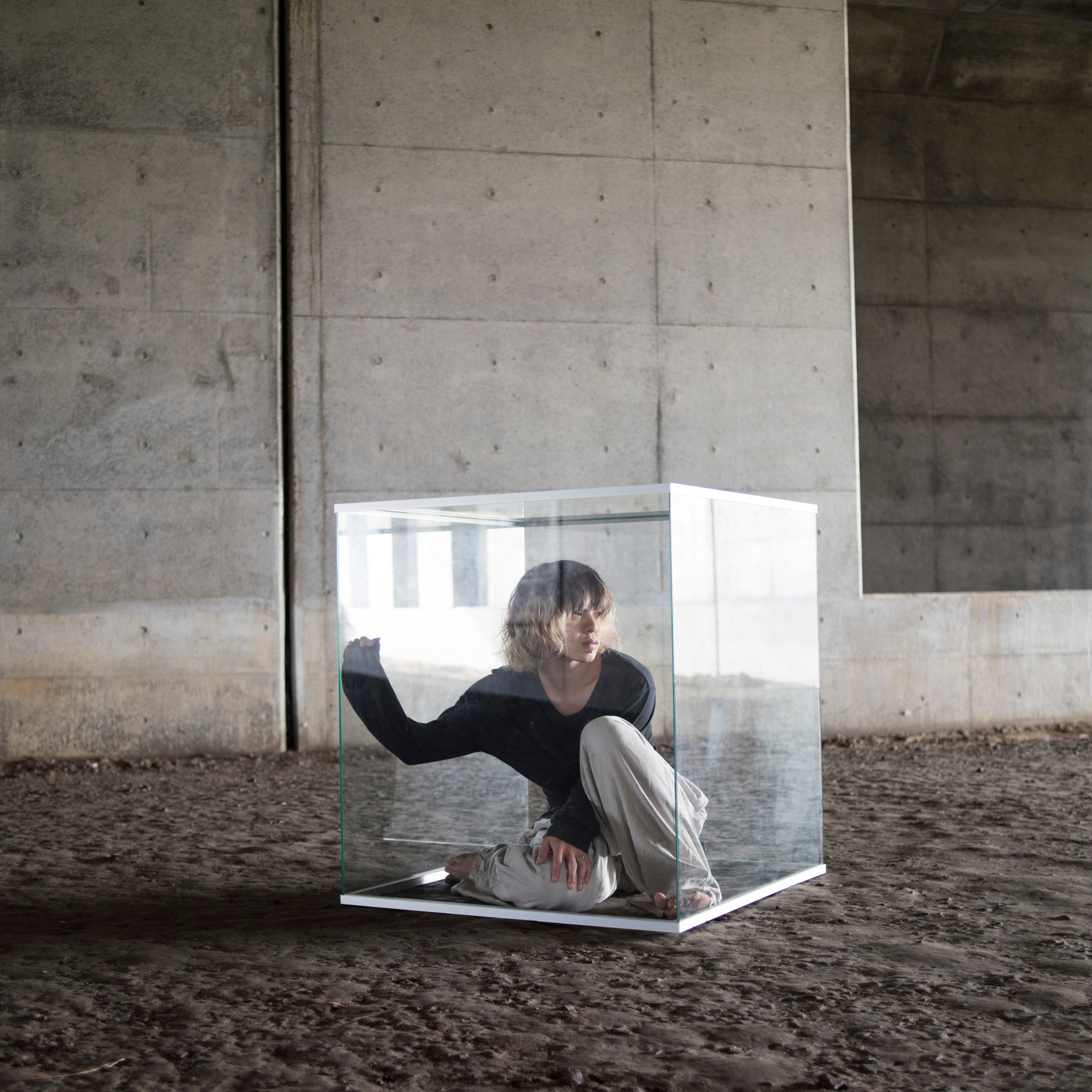 Woman in glass cube