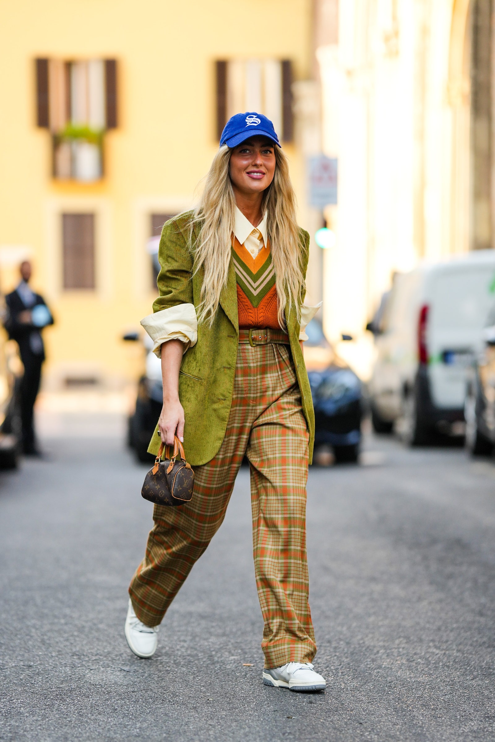 MILAN ITALY  SEPTEMBER 22 Emili Sindlev wears a royal blue with a white embroidered pattern cap a white latte shirt an...