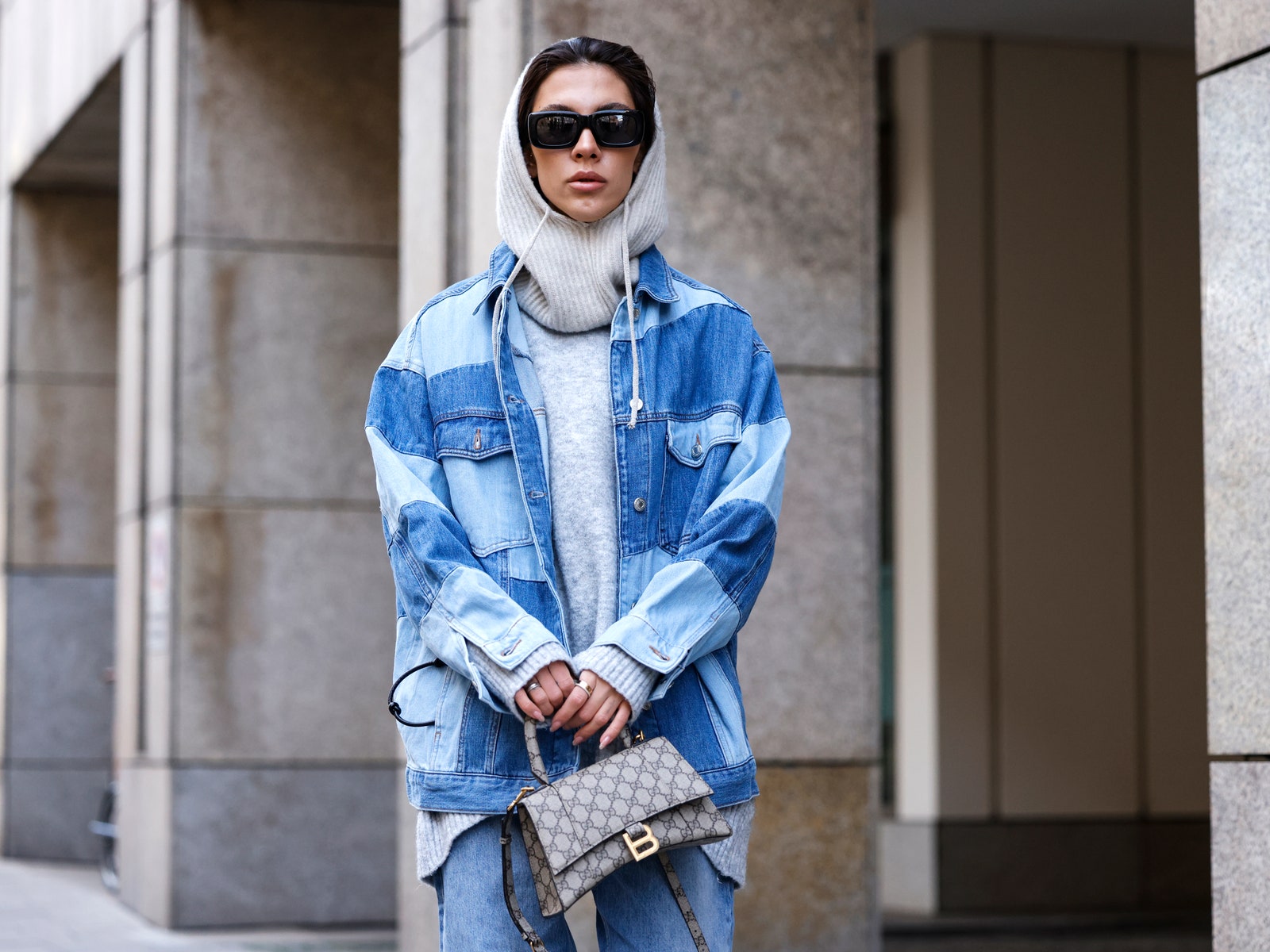MUNICH GERMANY  JANUARY 27 Influencer Nadine Tosun wearing a blue patchwork denim jeans jacket by Topshop blue denim...