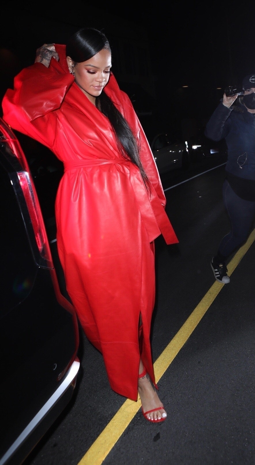 Santa Monica CA   A pregnant Rihanna covers her baby bump in all red leather as she exits a dinner date with AAP Rocky...